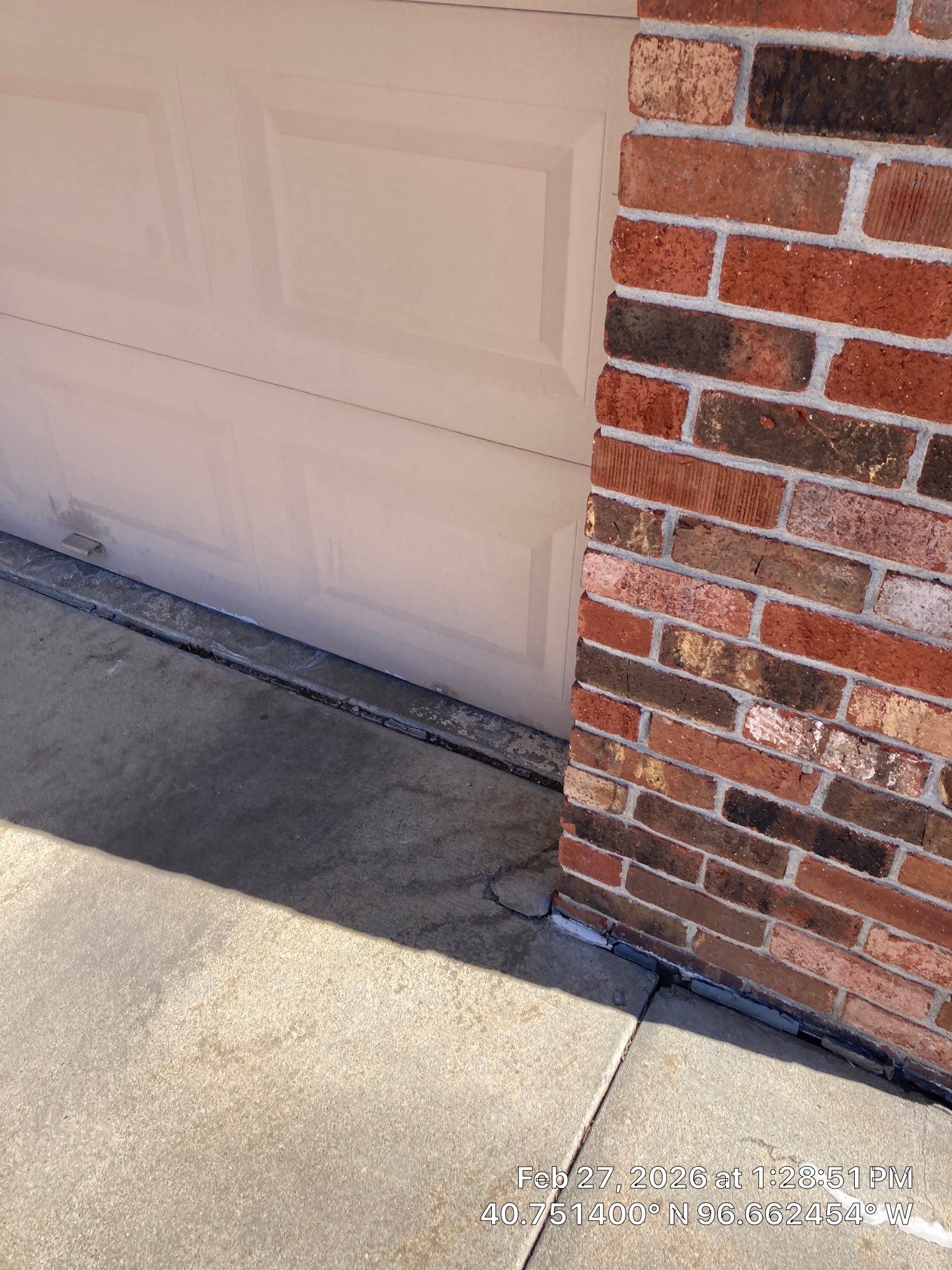 Underlying cause of sagging lintel above garage door in Midwest homes