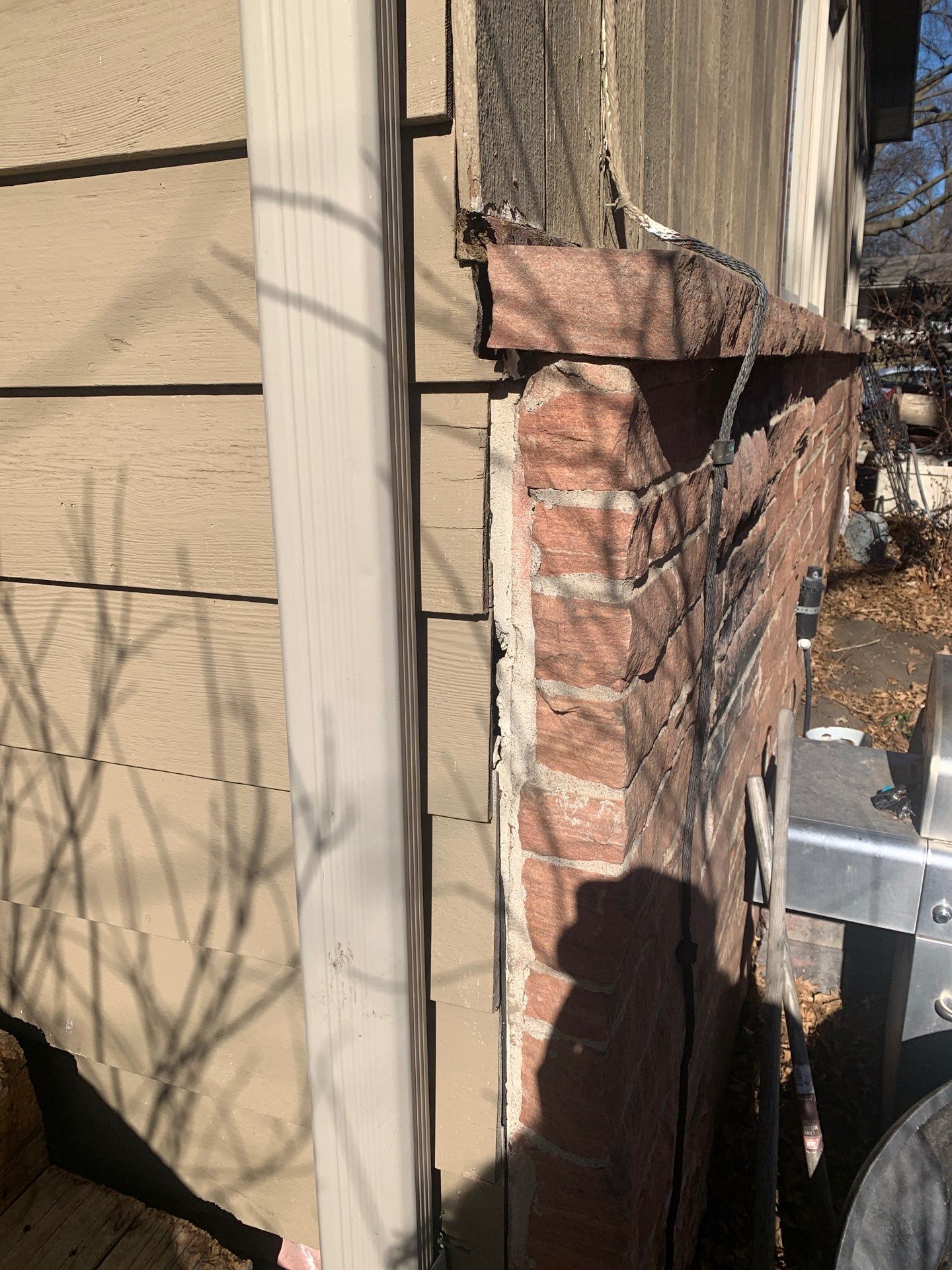 Gaps around windows, trim, or chimney.