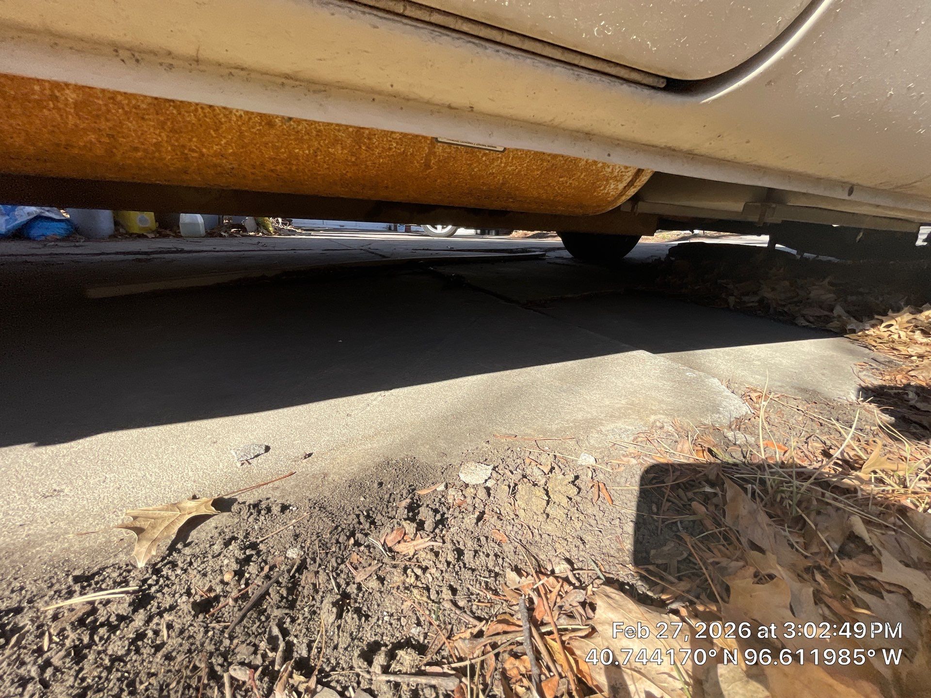 Early warning signs of sinking driveways diagnosed and lifted back to grade on a Midwest home