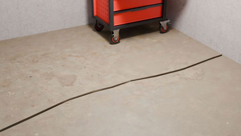Early warning signs of concrete floor cracks diagnosed by cause, not by width alone on a Midwest home