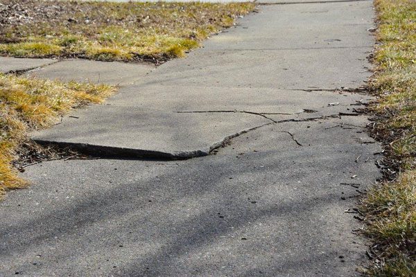 Early warning signs of broken sidewalks on a Midwest home
