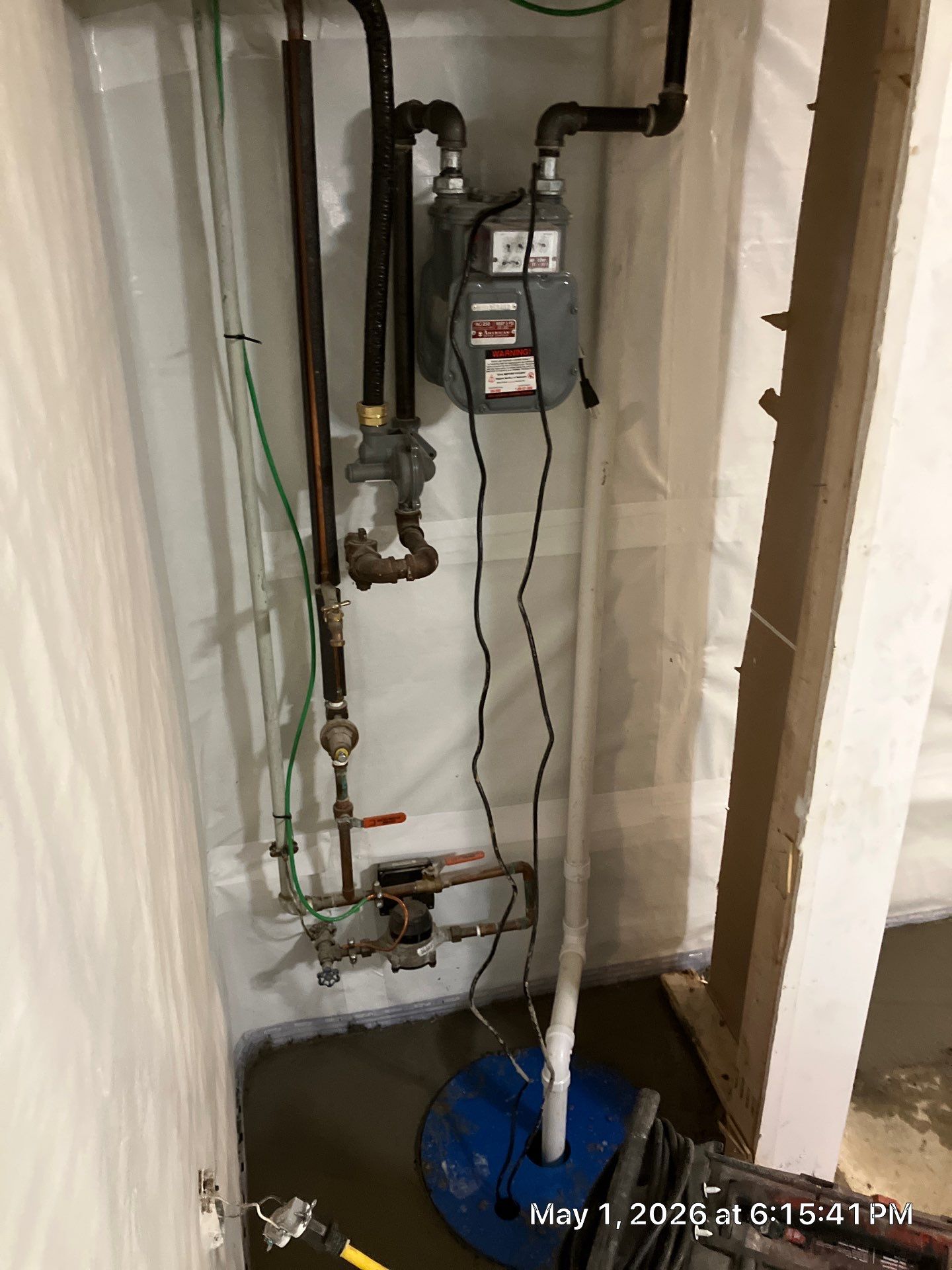 Epp Foundation Repair installing a backup sump pump system with a vapor barrier and drainage pipes in Omaha, Nebraska