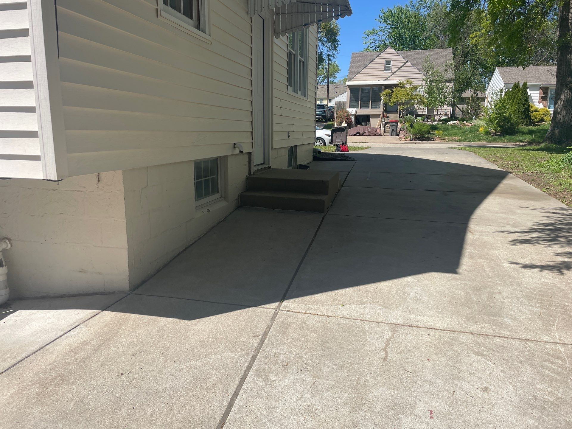 Early warning signs of cracked driveway on a Midwest home