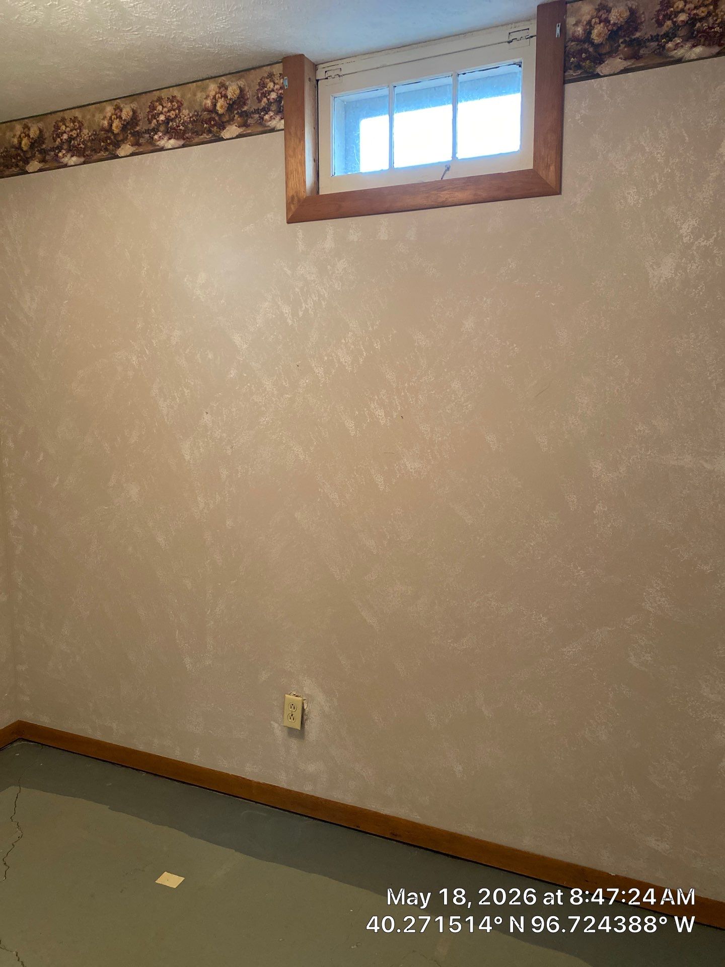 Epp Foundation Repair inspecting a significant concrete floor crack in a basement in Beatrice, NE